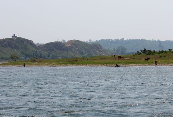 中朝边境美丽的风景,中朝边境桃花盛开的地方