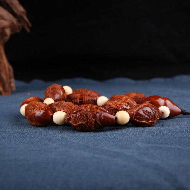 橄榄核盘红了怎么处理,橄榄核为啥盘花了