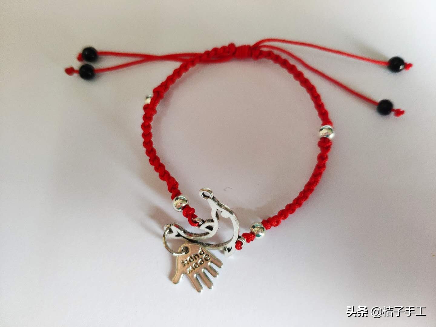 银饰弯管手链教程,足银双孔手链穿绳教程