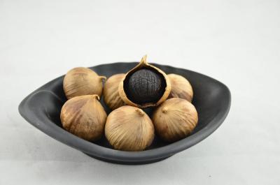 黑大蒜是糖蒜吗,金乡黑蒜是怎么做的