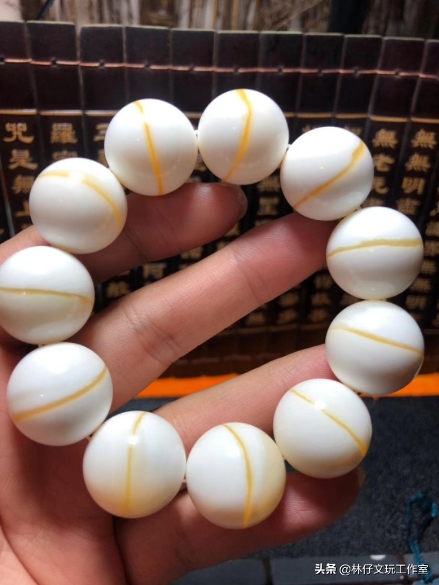 真假金丝砗磲对比照片,紫光灯照白砗磲的真假鉴别