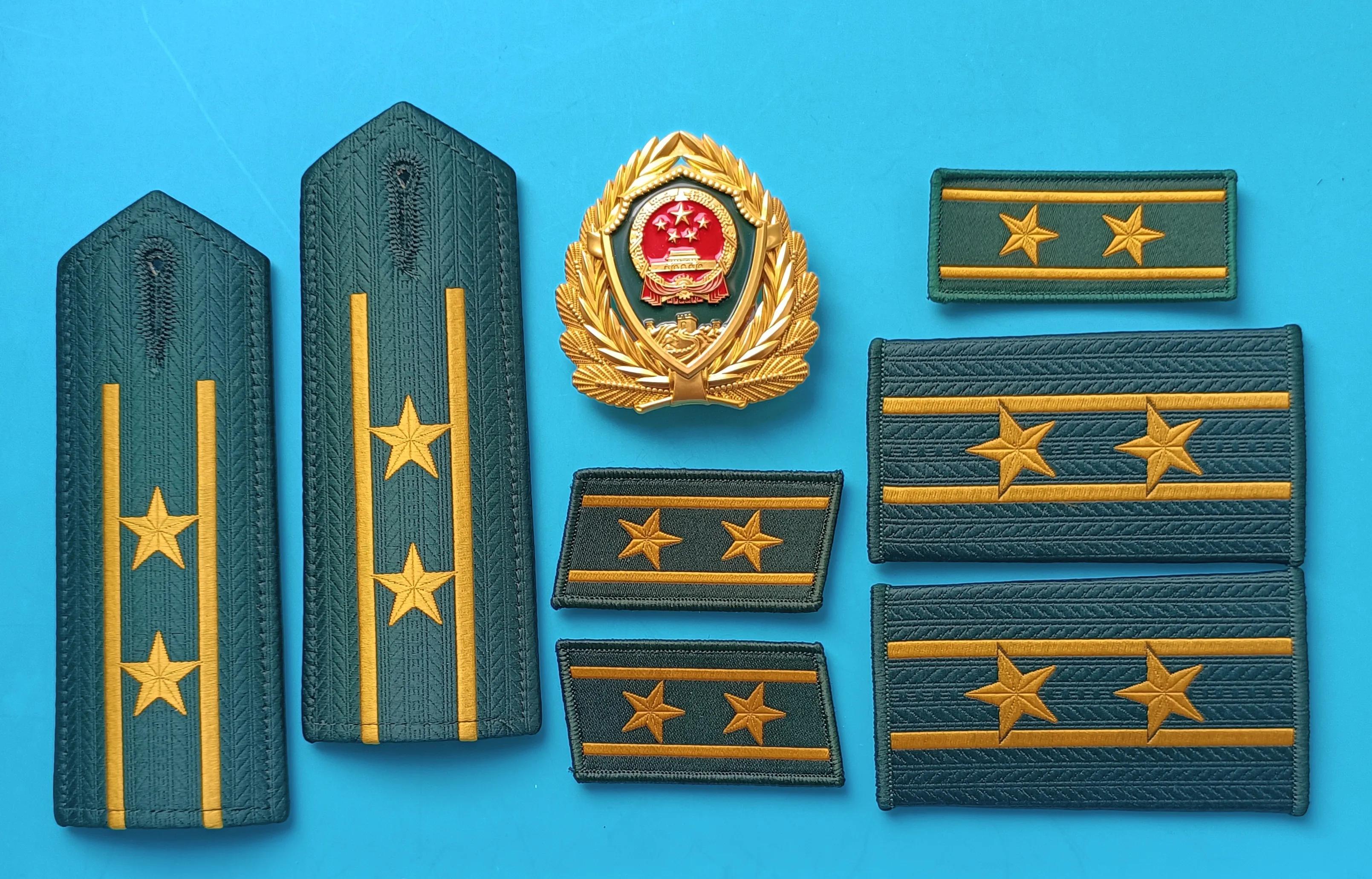 毛启国军装,毛启国警用帽徽