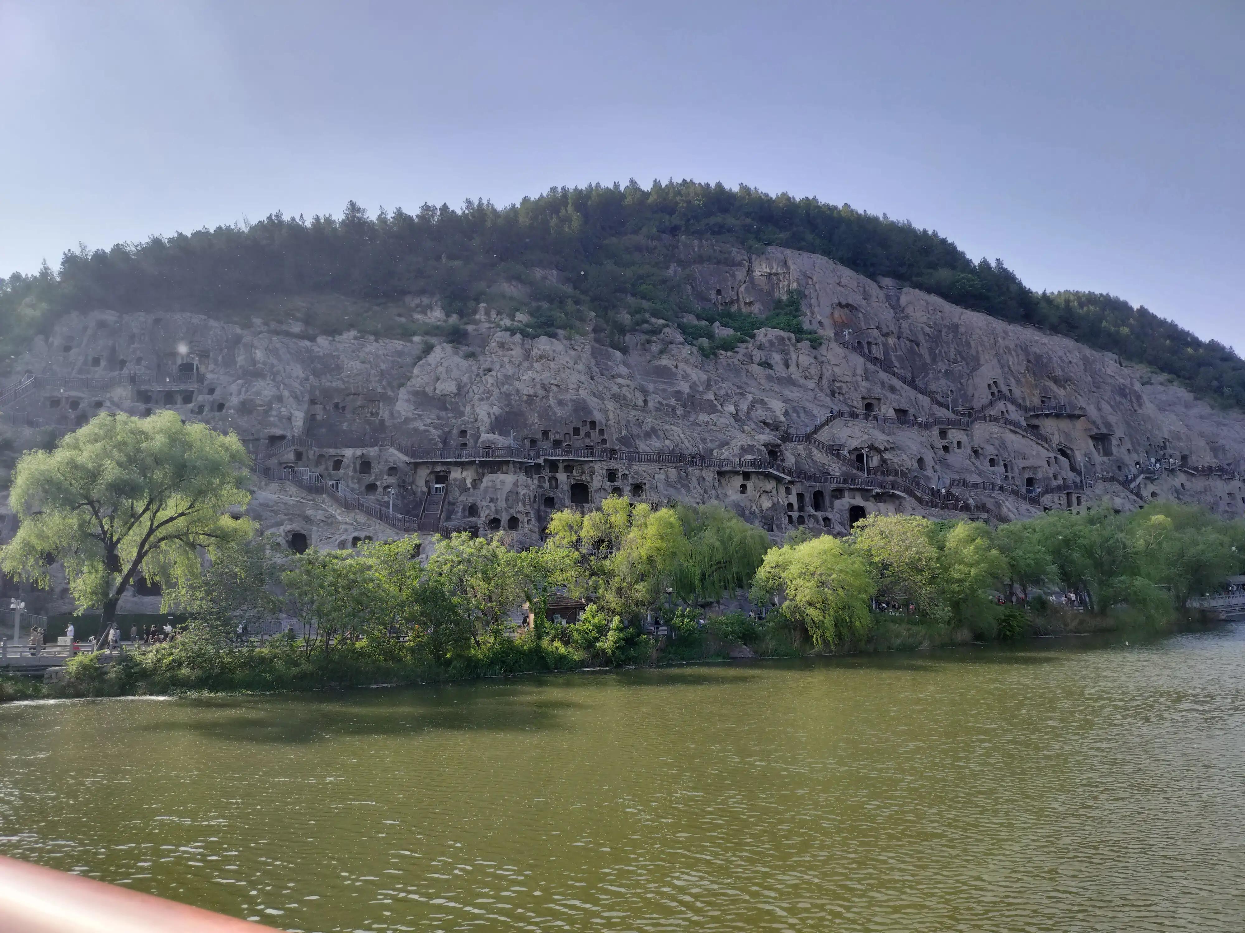 龙门石窟中国石刻艺术,龙门石窟被谁评为世界石刻最巅峰